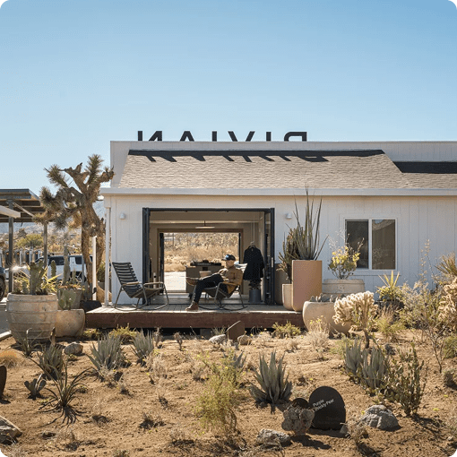 A wide view of the outdoor seating area of the Rivian Joshua Tree charging outpost.