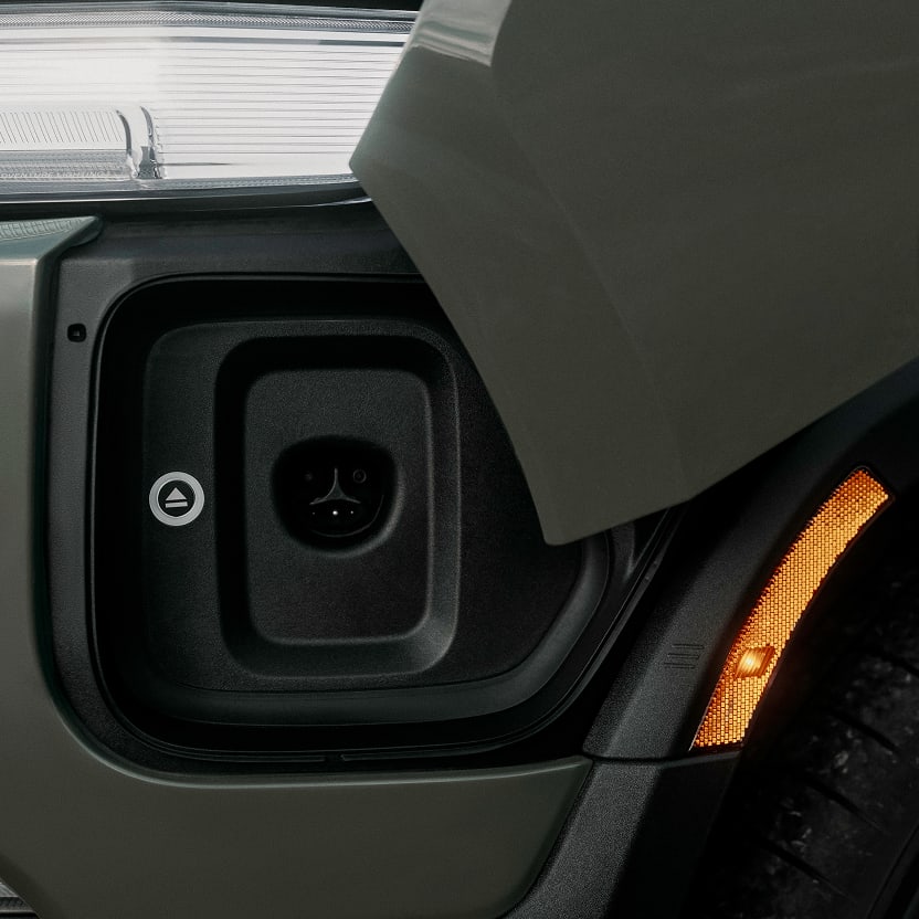 A Rivian vehicle's charging port, featuring native NACS integration.