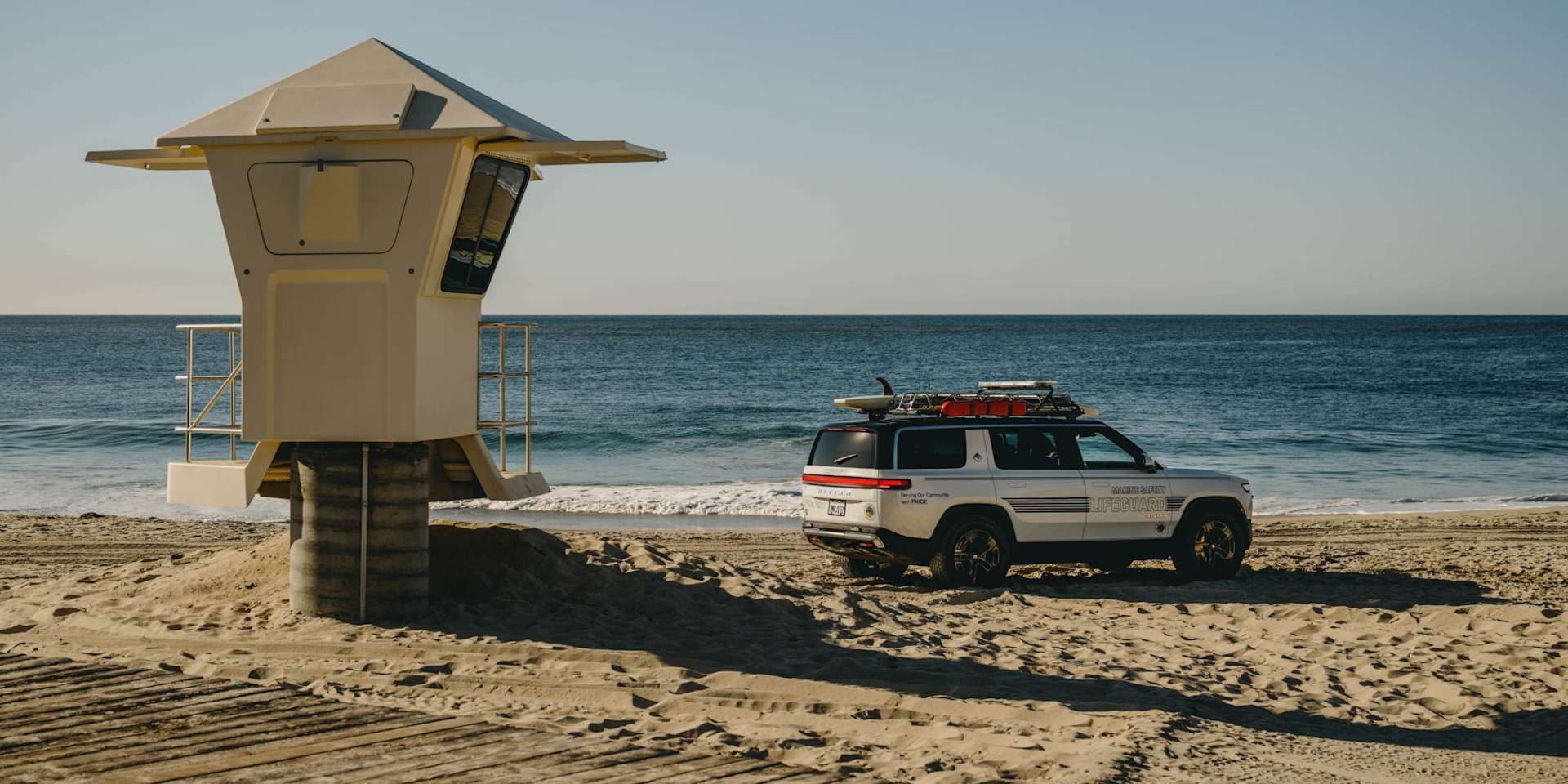 Rivian R1S on a beach