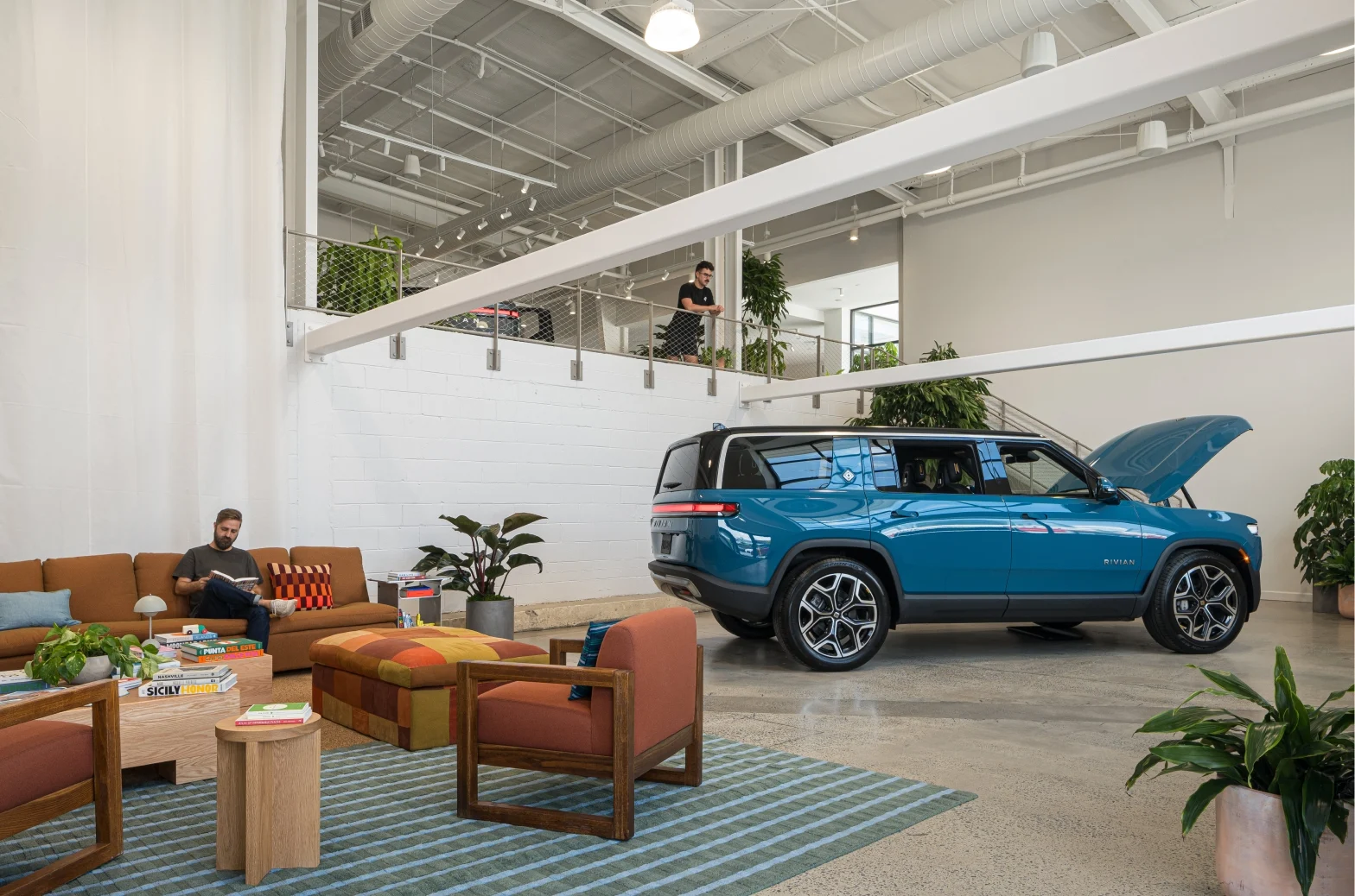 Blue Rivian R1S at Rivian Nashville Space