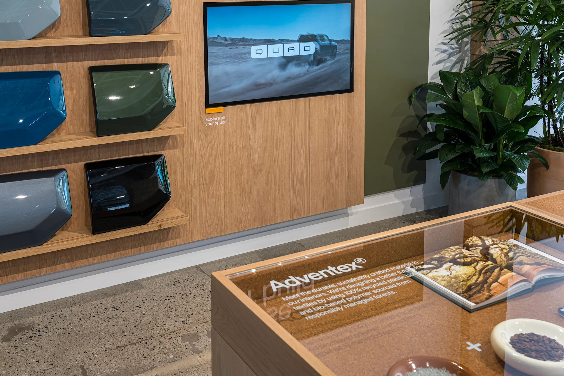Section of the Rivian Rocklin Service + Demo Center that features color swatches of all the different paint options that Rivian offers. These swatches are painted on a 1x1 foot squares of metal.