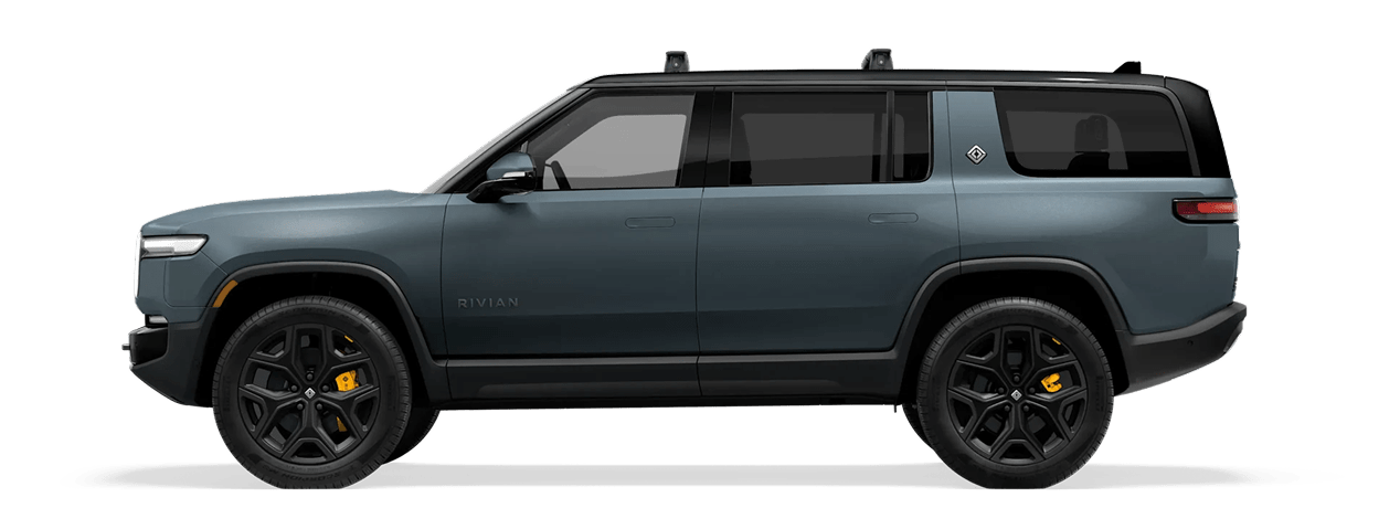 Silhouette of Limestone Rivian R1S electric SUV on a green studio background.