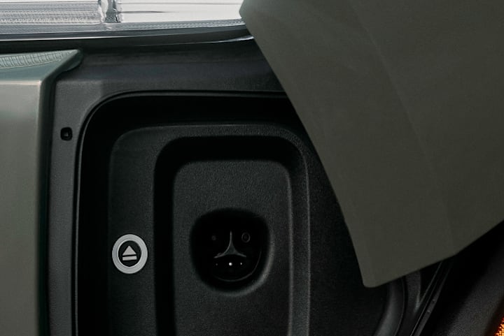 The charge port of a Rivian Quad motor electric vehicle. The port supports NACS charging,