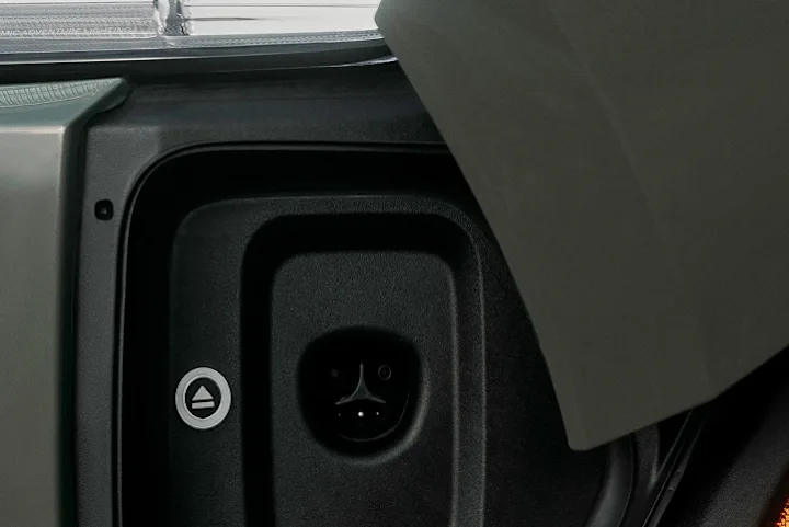 The charge port of a Rivian Quad motor electric vehicle. The port supports NACS charging,