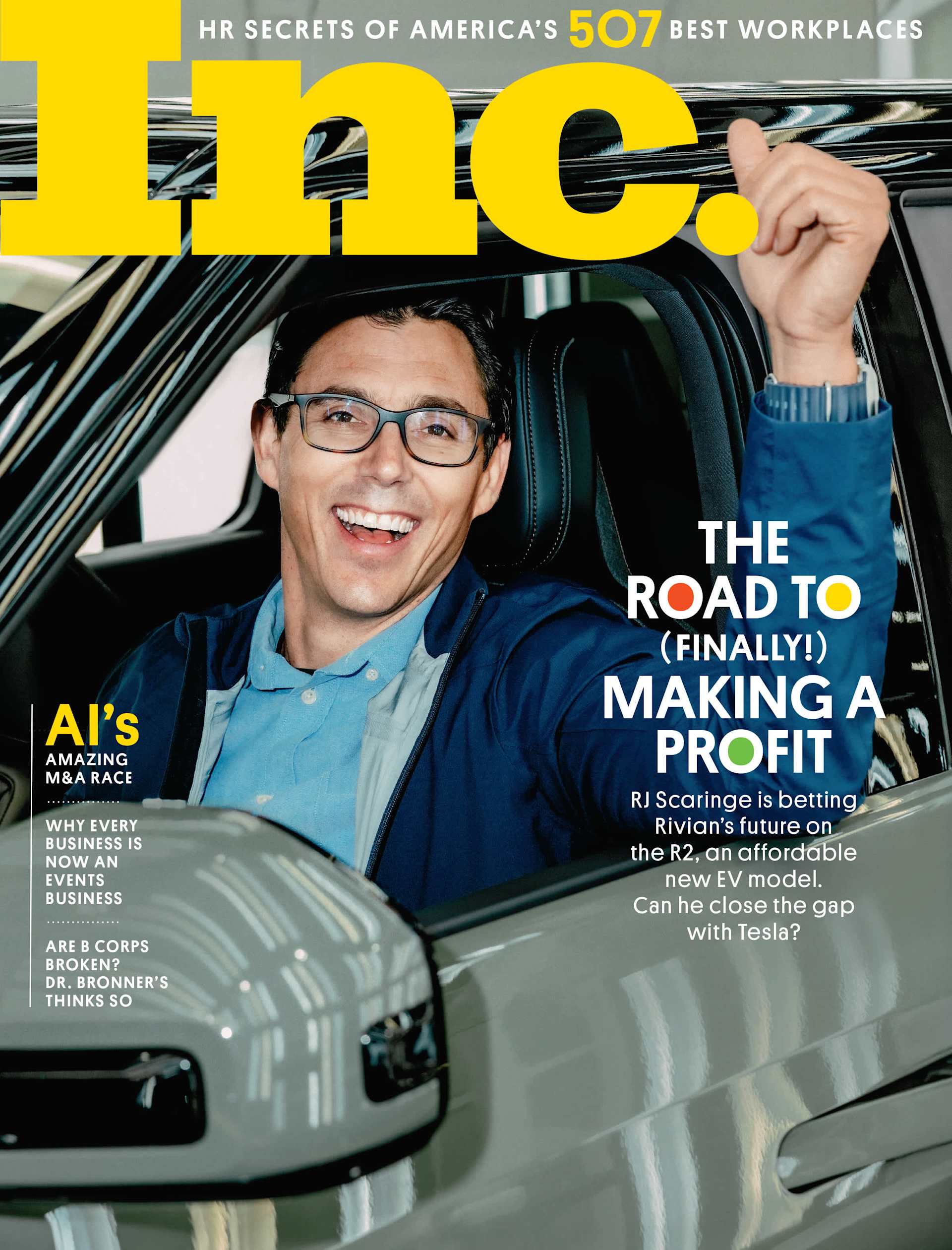 RJ Scaringe, in the driver's seat of a Rivian R2, smiles with his thumb raised on the cover of Inc. Magazine. The cover story is "The Road to (Finally