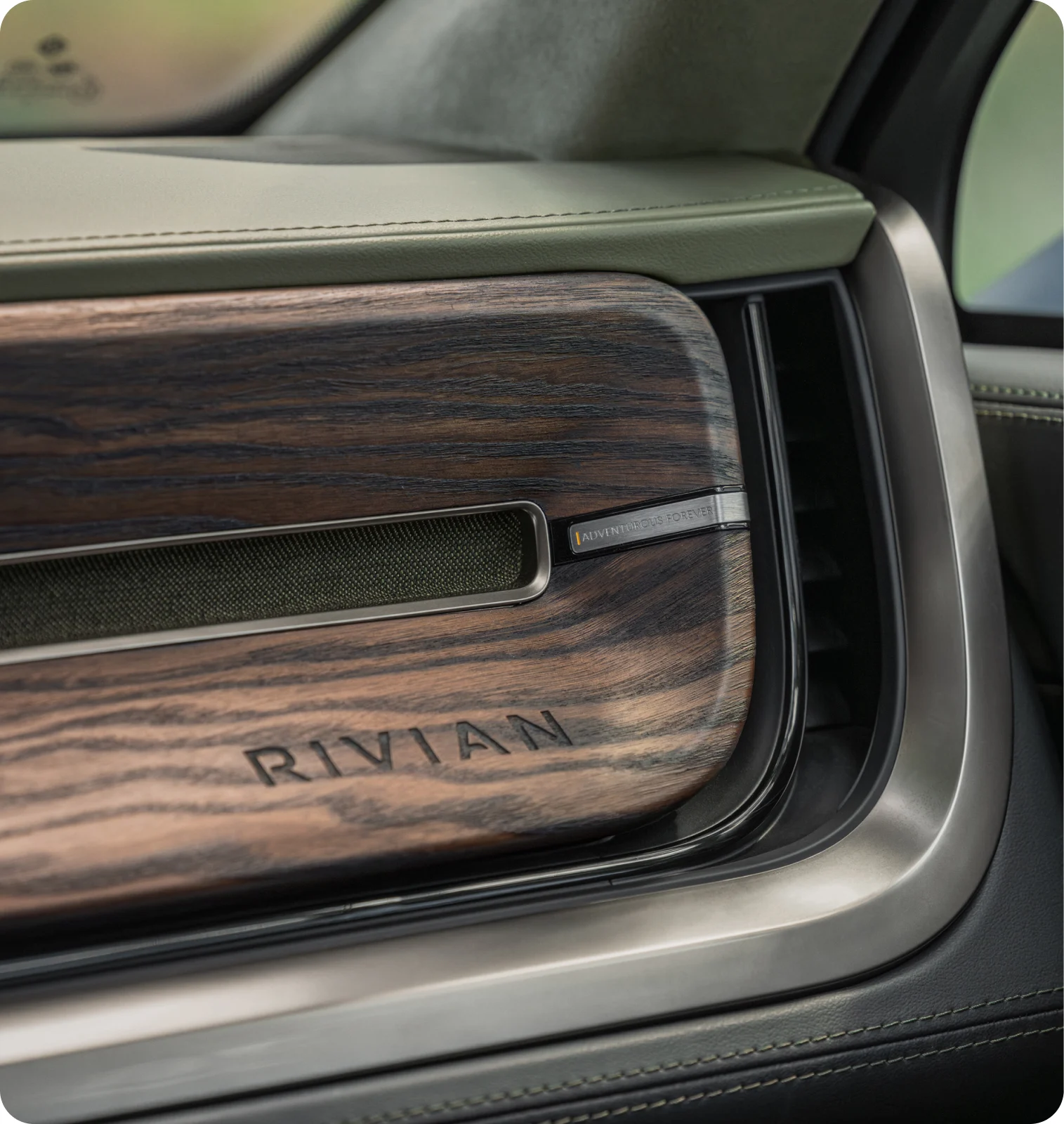 The interior of a Rivian R1S electric SUV, featuring the limited edition Forest Edge Package.