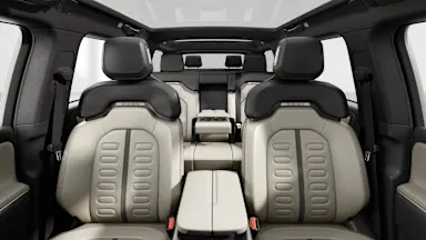 2025 R1S Sandstone + Dark Ash Wood back seats view