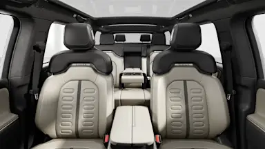 2025 R1S Sandstone + Dark Ash Wood back seats view