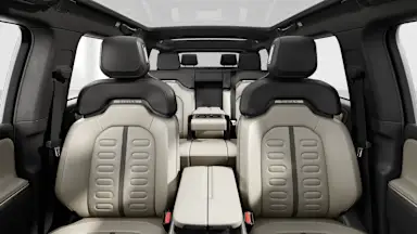 2025 R1S Sandstone + Dark Ash Wood back seats view