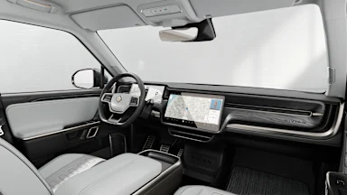 2023 R1S Ocean Coast + Dark Ash Wood driver seat view