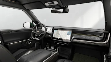 2023 R1S Black Mountain + Dark Ash Wood driver seat view