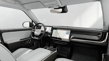 2024 R1S Ocean Coast + Dark Ash Wood driver seat view