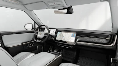 2024 R1S Ocean Coast + Dark Ash Wood driver seat view