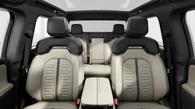 2025 R1T Sandstone + Dark Ash Wood back seats view