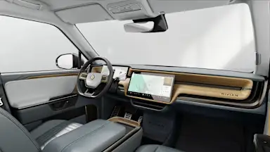 2027 R1T Slate Sky + Walnut Wood driver seat view