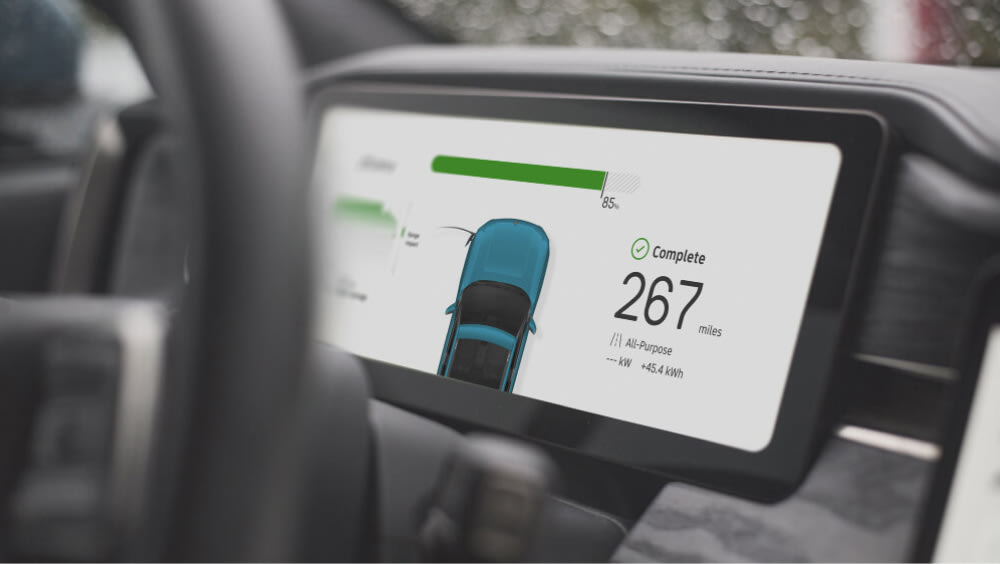 A screen inside a Rivian R1 showing status of a charging session.